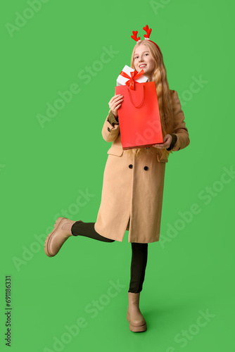 Young happy woman in warm w...