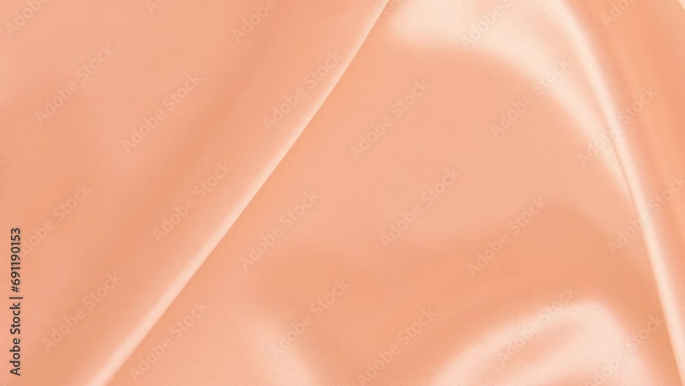 peach fuzz Color year 2024, peach silk fabric, delicate satin, elegant silk, background for designer, text mockup, luxury Color trend palette concept, texture, Frankfurt - December 7, 2023