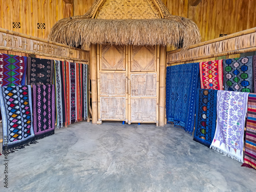 Colorful of Kain Tenun, an Indonesian traditional hand woven fabric from West Nusa Tenggara or Lombok, arranged for sale photo