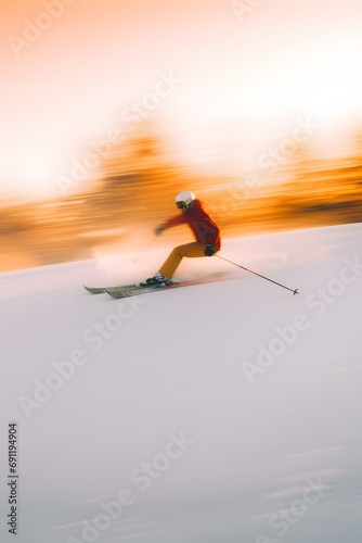 a skier sports athlete skiing on snow in winters with motion blur