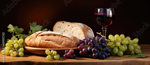 Bread grapes and wine as Communion symbols. Copy space image. Place for adding text