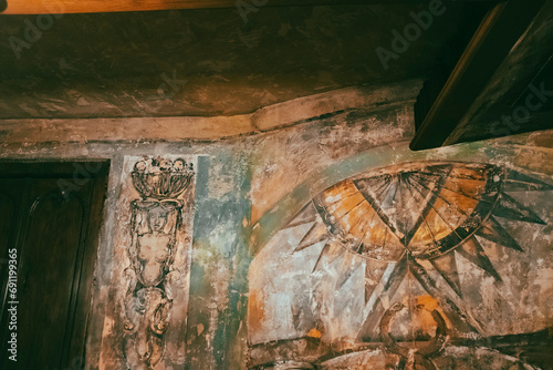 Old rusty paintings ruined on an old ruined interior domestic room photo