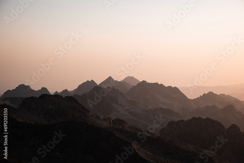 Panoramic view of the mountain skyline of the Pyrenees in a beautiful warm summer sunrise
