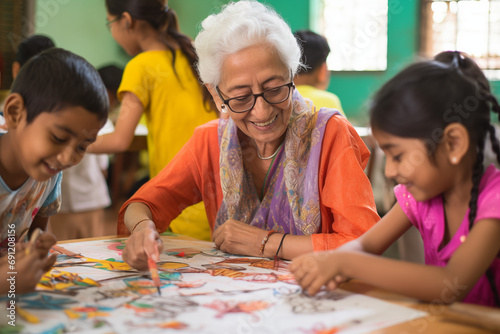 Children engaging in art sessions with elders, leaving space for messages on creativity and bonding photo