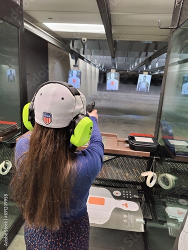 Girl Shooting at a shooting range