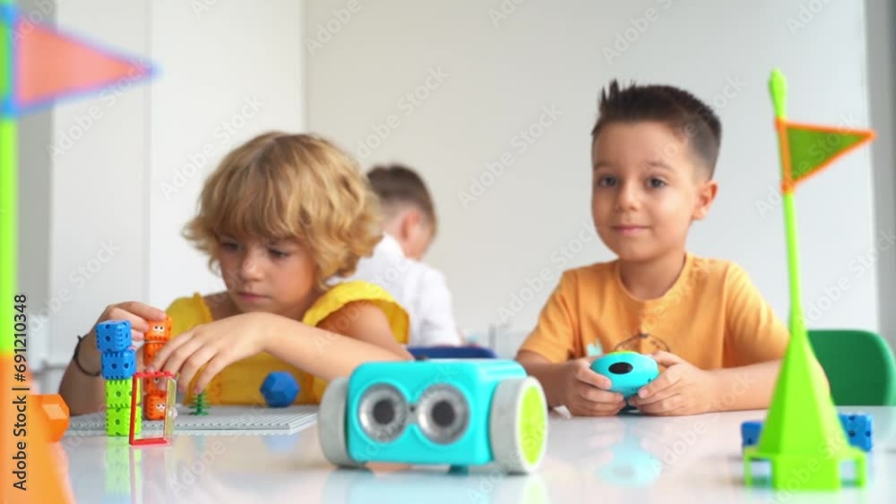 Children playing with toy car control panel in STEM educational class. Preschool kids exploring technology first steps Children playing with toy car control panel in STEM educational class. Preschool kids exploring technology first steps
