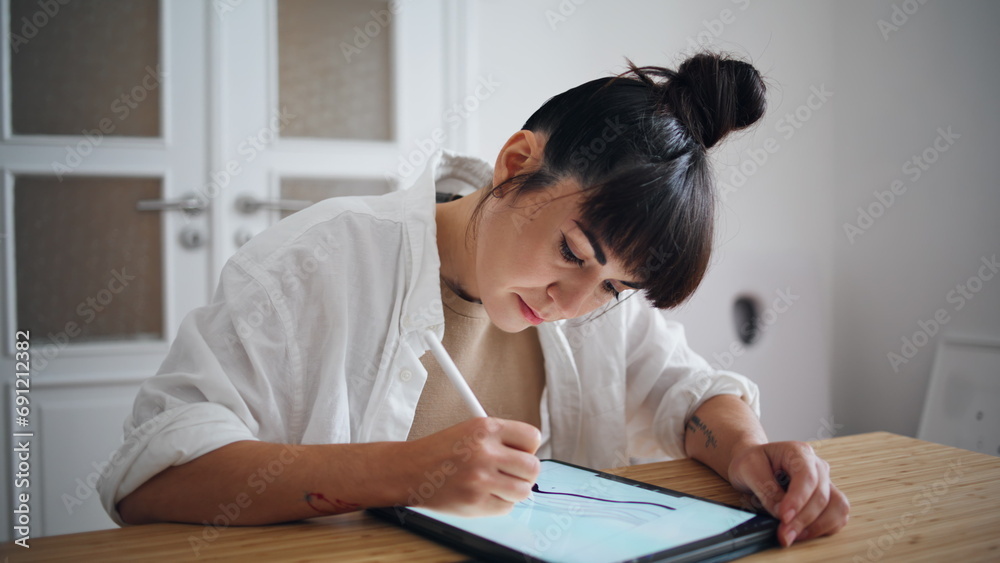 Focused woman sketching tablet home workplace closeup. Artist using graphic pad Focused woman sketching tablet home workplace closeup. Artist using graphic pad