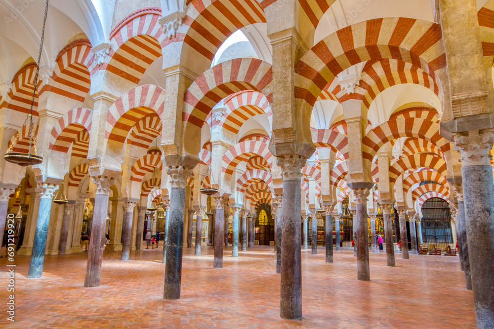 Interior vaulted ceiling of the Mezquita Cathedral, originally part of the Great Mosque of Cordoba - obrazy, fototapety, plakaty 