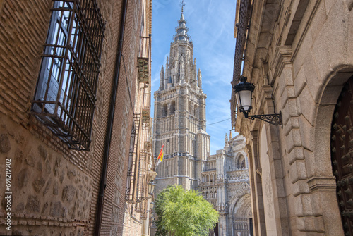 The Primatial Cathedral of Saint Mary of Toledo appears through the streets in historic Toledo, Spain photo