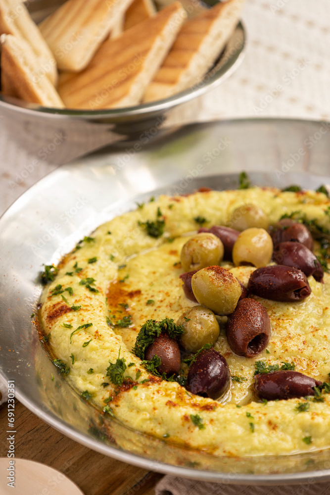 Delicious chickpea hummus with Kalamata olives Delicious chickpea hummus with Kalamata olives