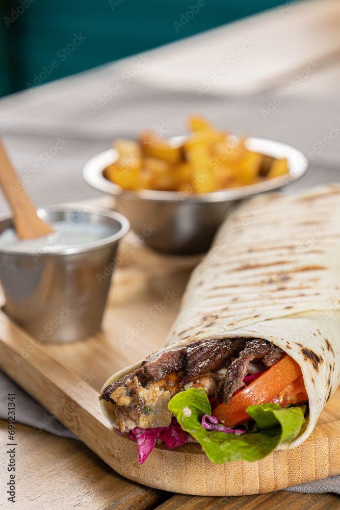 beef shawarma with vegetables and sauce