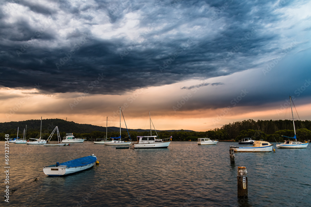 Sunset with storm clouds at the waterfront
