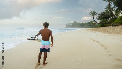 Canvas Print Man surfer on the beach before surfing