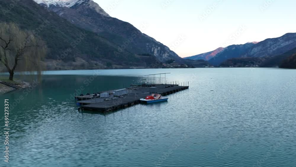 Aerial Rotating Drone shot of boat's platform on Ledro's Lake - Not Graded Aerial Rotating Drone shot of boat's platform on Ledro's Lake - Not Graded