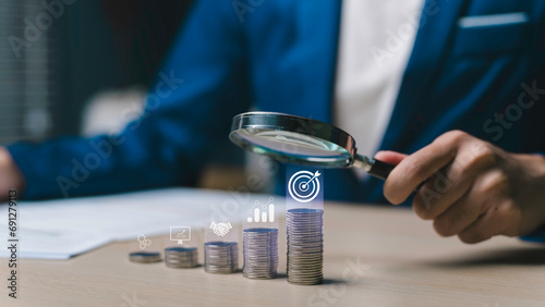 Obraz na płótnie business target A magnifying glass on cooperation concept, financial growth, strategy, investment, success, and achieving new heights in the market. w salonie