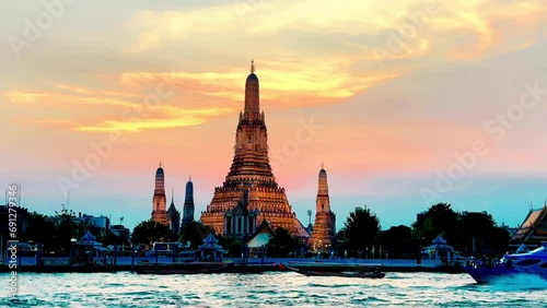 4K Wat Arun Ratchawararam at sunset(Temple of Dawn) famous tourist destination in Bangkok, Thailand.  photo