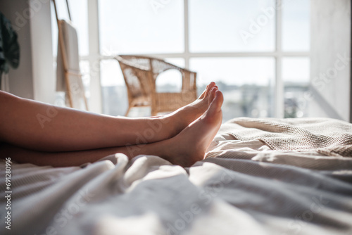 legs of a resting girl on the bed © Павел Чигирь