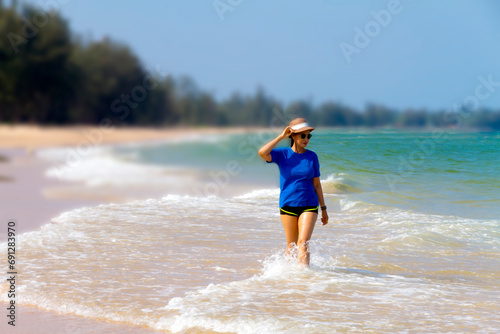 Woman walk relax at beach Bang Boet photo