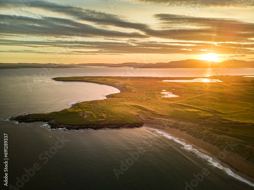 Irelands West on Achill Island. Drone shot of the coast at sunset photo