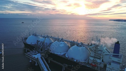 Aerial of Liquified Natural Gas LNG carrier moored to a small gas terminal. Fuel crisis. Sanctions photo