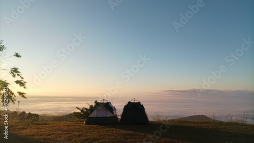Two camp on  the mountain see view sea of mist and sunsine in the morning.
