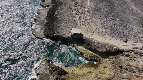 Aerial view along the coastline of a Caribbean island photo