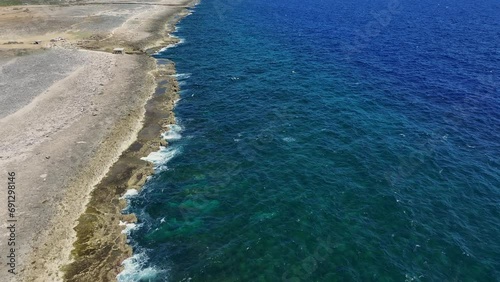 Aerial view along the coastline of a Caribbean island photo