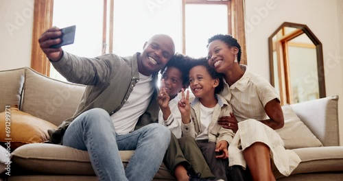 Happy black family, relax and selfie for photography, picture or memory together on sofa at home. Face of African mother, father and children smile in photograph, social media or living room at house photo