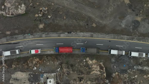 Aerial drone top down shot over the congested road along the mountain slope after landslide over Skardu road, Pakistan at daytime. photo
