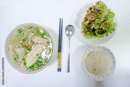 chicken and noodles soup with rice and lettuce Korean food