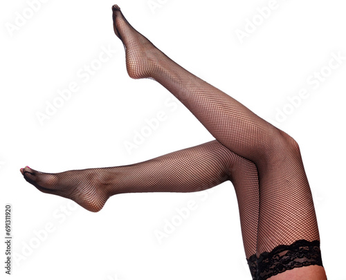 Beautiful long woman's legs in black net pantyhose, isolated photo
