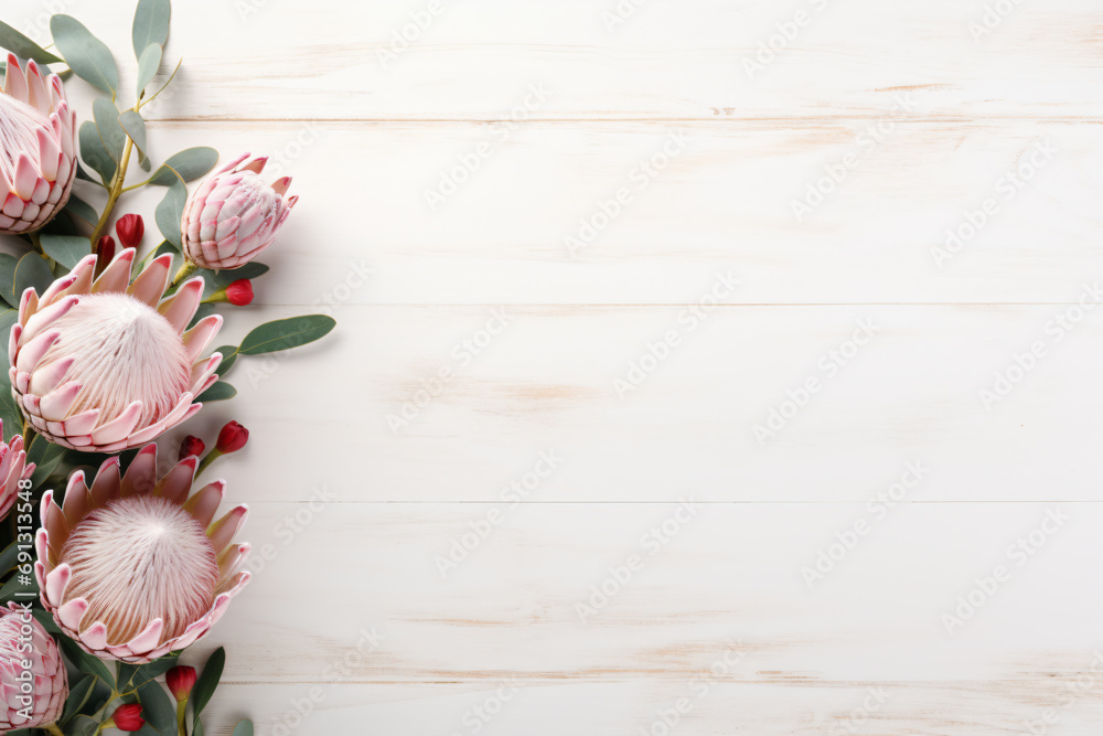 a bunch of pink flowers on a white wooden table
