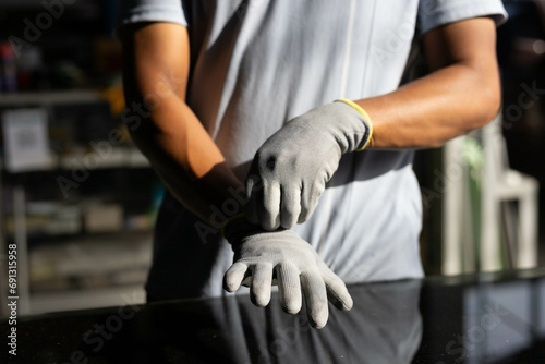 Fototapeta Naklejka Na Ścianę i Meble -  Gloves for cutting glass and sharp objects, rubber gloves, white gloves