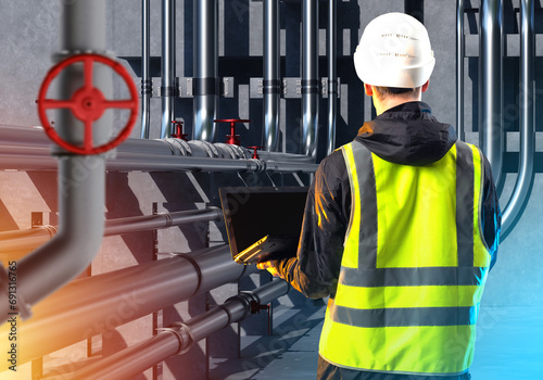 Industrial worker with lapt...