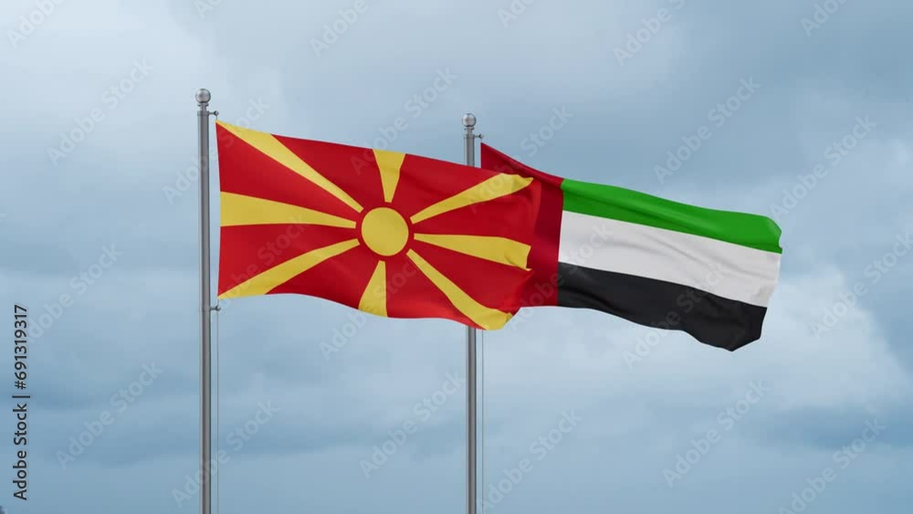 United Arab Emirates and North Macedonia flag waving together on cloudy sky, endless seamless loop, two country cooperation concept United Arab Emirates and North Macedonia flag waving together on cloudy sky, endless seamless loop, two country cooperation concept