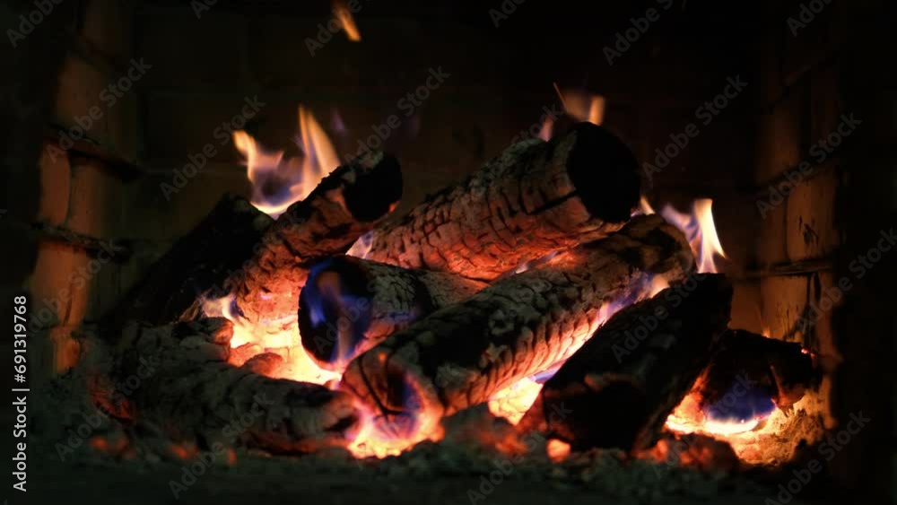 A fireplace with burning logs. Fire in the fireplace. A cozy place to rest. Fire and firewood as background. Burning wood in the furnace. Fire video A fireplace with burning logs. Fire in the fireplace. A cozy place to rest. Fire and firewood as background. Burning wood in the furnace. Fire video
