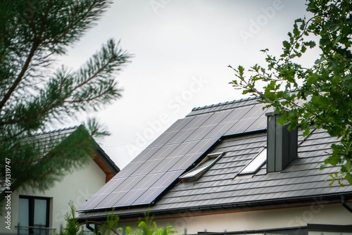 House roof with photovoltaic modules. photo