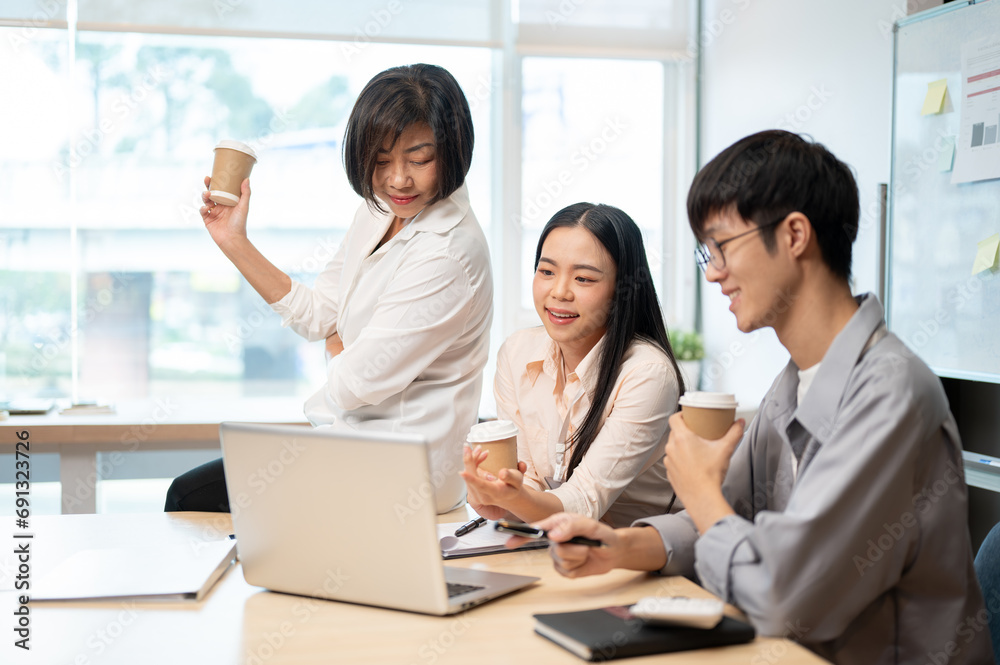 Group of Asian business people are in the meeting, talking and brainstorming on a new project. Group of Asian business people are in the meeting, talking and brainstorming on a new project.