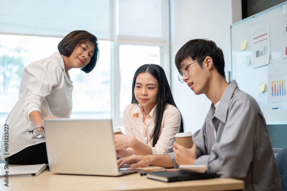 Group of Asian business people are in the meeting, talking and brainstorming on a new project. Group of Asian business people are in the meeting, talking and brainstorming on a new project.