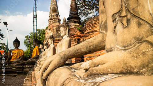 Row of ruined statue of buddha at Wat Yai Chaimongkol,Wat Yai Chai Mongkhon, Ayuthaya, Thailand,Asia photo