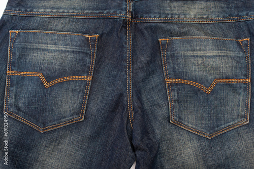 Closeup of Back Side of Pair of Dark Blue Washed Mens Jeans On Pure White