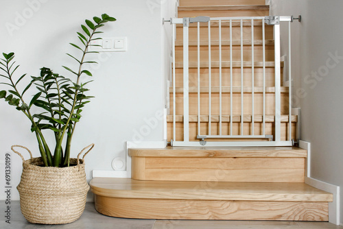 Barrier safety gate for children. Safety gates for children are installed on the stairs