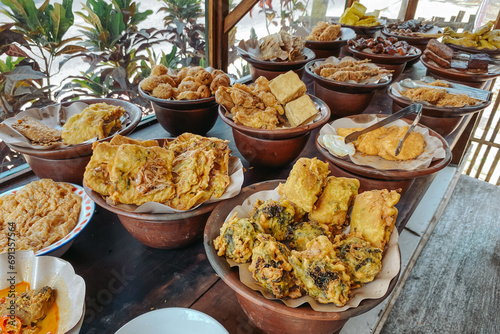 Various Indonesian side dishes displayed at the food stall or warung makan photo