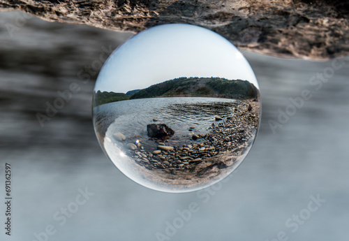 Lens ball at lake near the Cape Breton Island Coast line cliff scenic Cabot Trail route, Nova Scotia Hghlands Canada