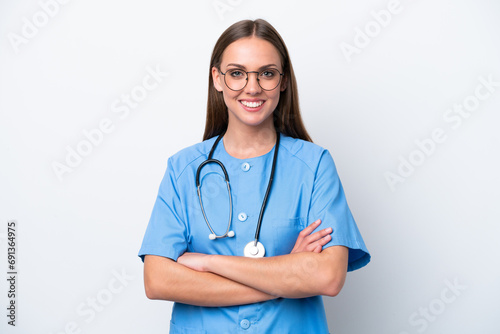 Young nurse caucasian woman isolated on white background keeping the arms crossed in frontal position