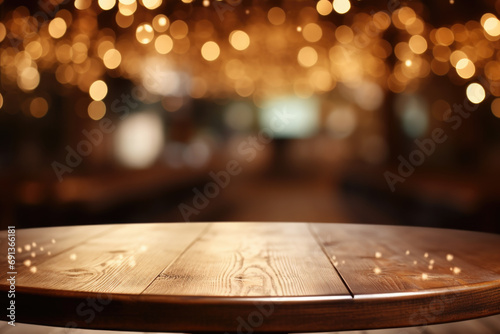 Simple wooden table with captivating display of lights in background. © vefimov
