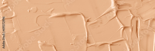 Texture of liquid foundation in color of the year 2024 Peach Fuzz  banner