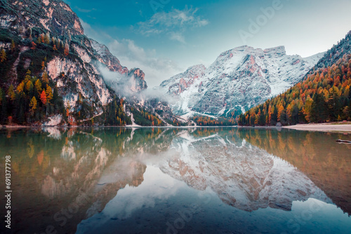 Great view of the mighty rock above peaceful alpine lake Braies. National park Fanes-Sennes-Braies, Italy, Europe. © Leonid Tit