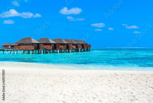 tropical Maldives island with white sandy beach and sea. beach and beautiful tropical sea