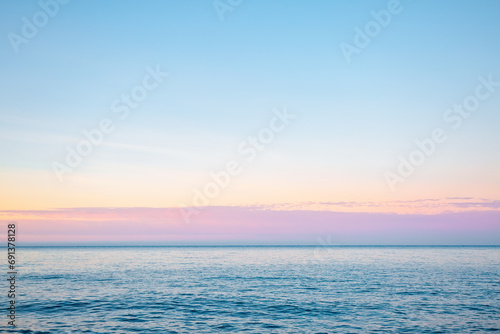 Horizontal line of calm sea in soft morning light. Sicily, Italy, Europe. © Leonid Tit